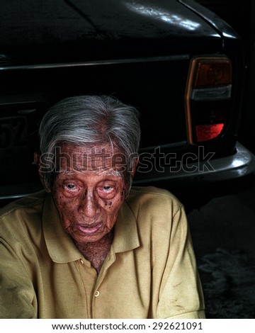A retired Thai Government worker. This is an editorial photo taken June 25th, 2015 in Bangkok Thailand.