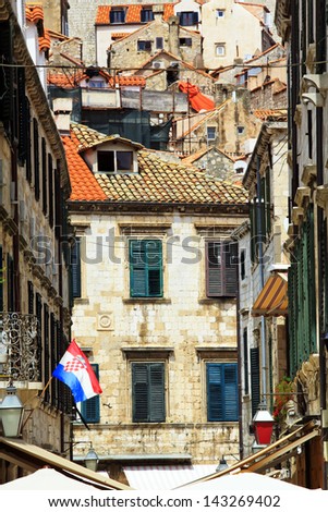 Back streets of Dubrovnik with Croatian flag