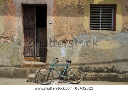Bike outside simple building in Baracoa, Cuba - landscape