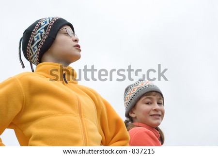 Photo of Kids in Ski Hats and Fuzzy Pullovers isolated on white background