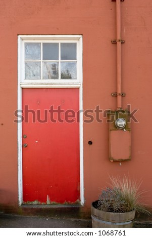 Photo of a Red Wall, Red Door, and Electric Meter