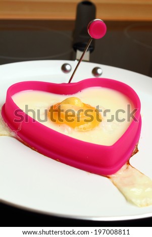 Frying Egg Sunny Side Up in Heart Shape Egg Ring