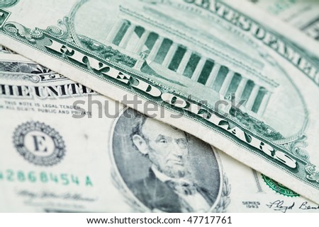 Money background - US dollars background. Close up photo with shallow DOF and space for your text