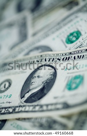 Money background - US dollars background. Close up photo with shallow DOF and space for your text