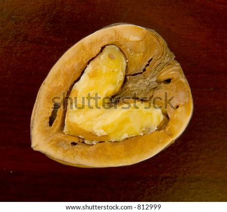 A heart shaped walnut. Close up. Warm tint.