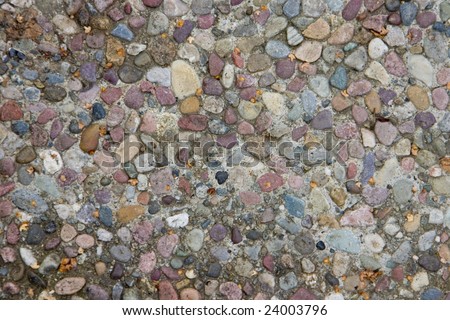 many pebbles in aggregate concrete which can be used as a background