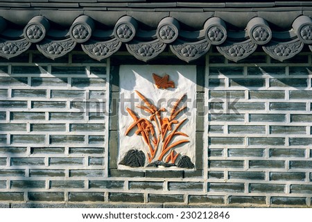 Oriental Wall; a brick wall in oriental style with ceramic decoration