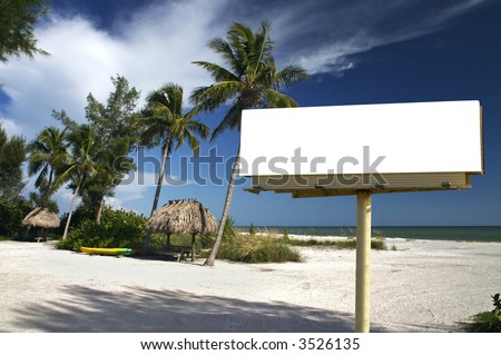 Tropical beach setting with a place to eat - included is a white billboard for you to place text or an advertisement - maybe for a travel ad?