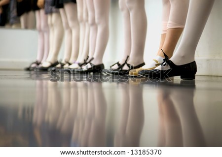 Young tap dancer... low angle shot of just feet and legs