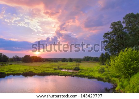 Beautiful sunrise landscape with flood waters of Narew river