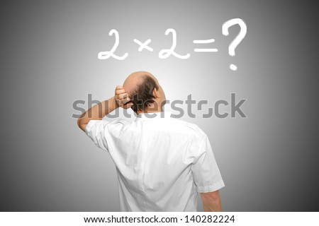 The businessman looks at the formula and thinks