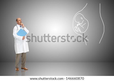 The doctor with the book and stethoscope looks at pregnancy