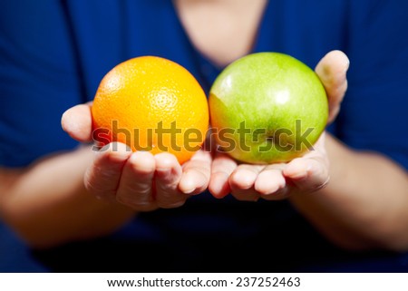Elderly woman with fruits. Healthy diet and nutrition.
