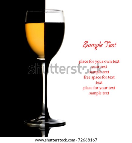 Closeup wine glass over black and white background and space for text