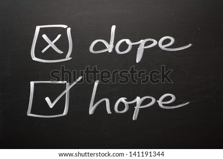 A drug abuse or drug rehabilitation concept on a blackboard using tick boxes for the words dope and hope. Say no to Dope and yes to Hope