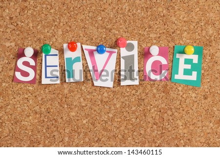 The word Service in cut out magazine letters pinned to a cork notice board