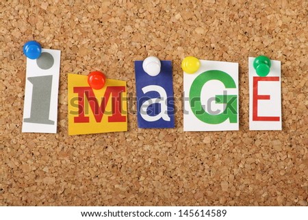 The word Image in cut out magazine letters pinned to a cork notice board. Image may refer to the self or the brand and public image of an organisation or business.