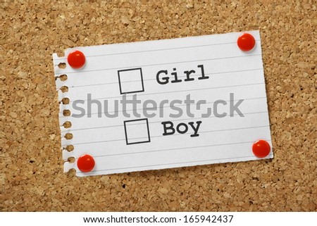 Girl or Boy Tick boxes on a piece of paper pinned to a cork notice board.