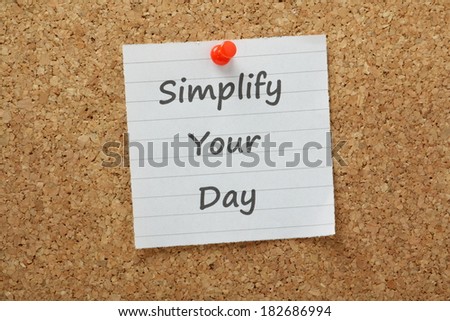 The phrase Simplify Your Day typed on lined paper and pinned to a cork notice board. If we simplify tasks or projects by breaking them into smaller chunks we are more productive and motivated to work