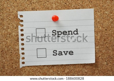 Spend or Save tick boxes on a piece of note paper pinned to a cork notice board.