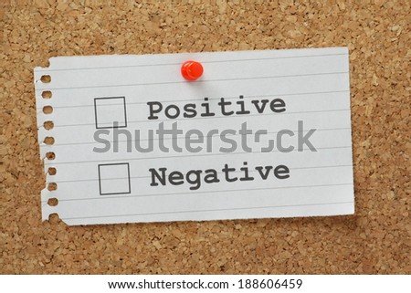 Positive or Negative tick boxes on a cork notice board