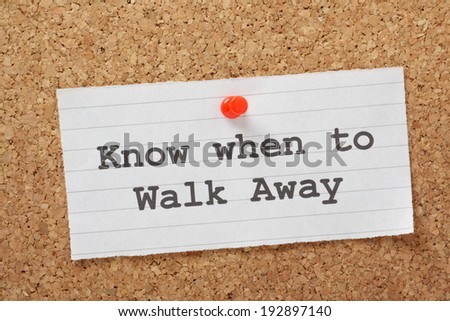 The phrase Know When to Walk Away on a paper note pinned to a cork notice board. This may relate to relationships or risk in business