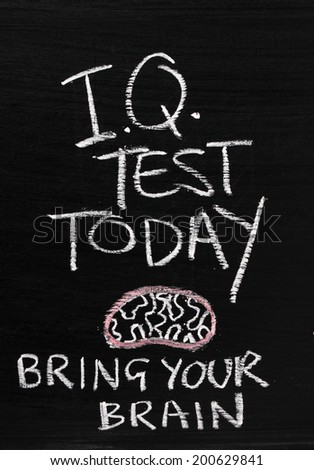 The phrase IQ Test Today written on a blackboard sign with a reminder to Bring Your Brain