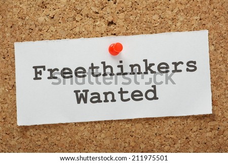 The phrase Freethinkers Wanted typed on a piece of paper and pinned to a cork notice board