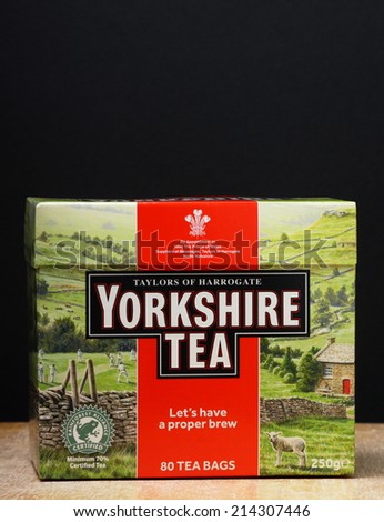 Bracknell, England - September 1st, 2014: A box of Yorkshire Tea bags on a table top in front of a black background. Taylors of Harrogate have been providing tea in England since 1886