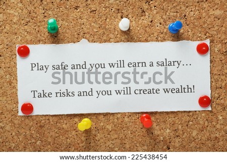 Playing it safe versus taking risks concept for entrepreneurs or people in work typed on a piece of paper and pinned to a cork notice board