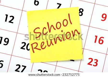 Reminder of a School Reunion written on a yellow sticky note and attached to a wall calendar
