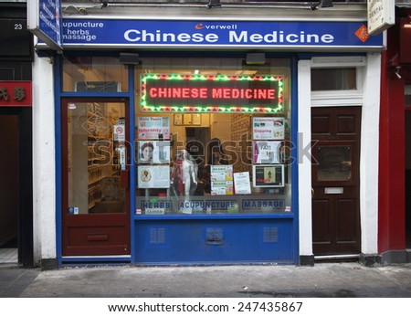 London, England - January 24, 2015: Exterior of a Chinese Medicine Store in the Chinatown area of London. Traditional Chinese Medicine is a distinct and independent system more than 2000 years old.