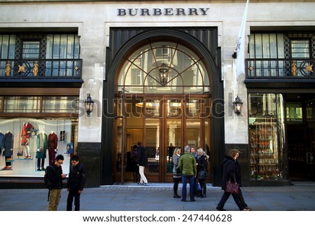 London, England - January 24, 2015: People in front of and entering the Burberry flagship store in Regent Street, London. The brand was founded by Thomas Burberry in 1856