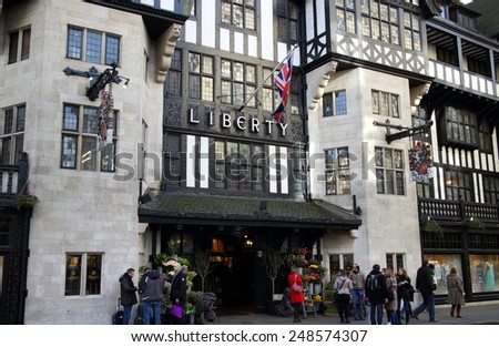 London, England - January 24, 2015: People standing by the entrance of the Liberty Store in Regent Street, London. Opened in 1875 the store is identified with luxury goods and classic designs.