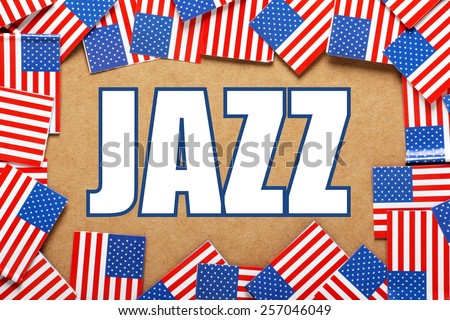 Miniature flags of the United States of America form a border on brown card around the word JAZZ