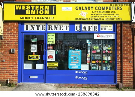 Reading,England - March 6, 2015: Computer hardware and software business in Reading, England providing an Internet Cafe, Western Union money transfers and mobile phone services in the High Street.