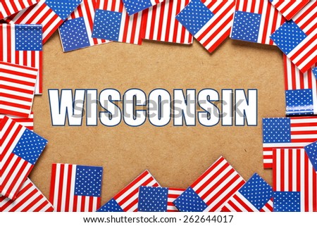 Miniature flags of the United States of America form a border on brown card around the name of the state of Wisconsin