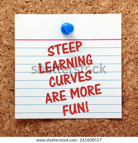 The phrase Steep Learning Curves Are More Fun on an index card pinned to a cork notice board as a reminder.