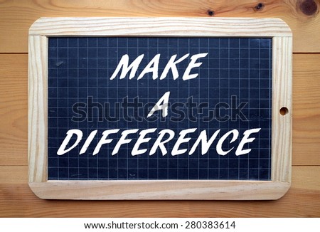 The phrase Make A Difference in white text on a slate blackboard