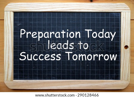 The phrase Preparation Today leads to Success Tomorrow in white text on a slate blackboard