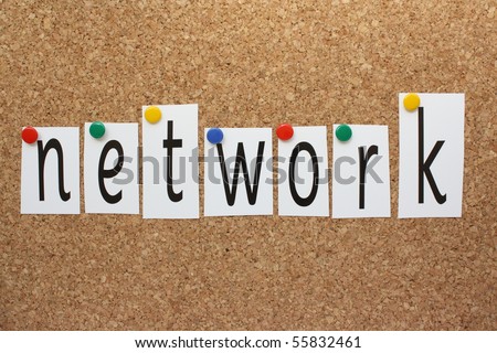 The word Network in cut out letters pinned to a cork background