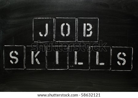 The words JOB SKILLS in stencil letters on a blackboard