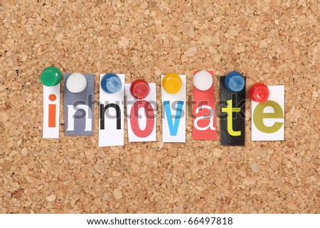 The word Innovate in cut out magazine letters pinned to a cork notice board