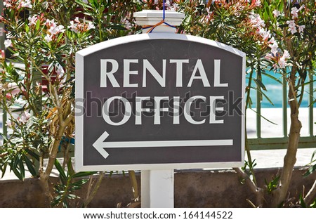 Rental sign shows direction where the office is located at.