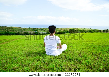portrait of healthy young man doing yoga back