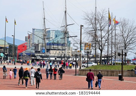 BALTIMORE - MAR 22: Crowds gather in Baltimore's Inner Harbor on beautiful weekend day at beginning of Spring on March 22, 2014  in Baltimore, MD.