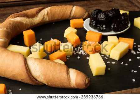 yellow and white cheddar cheese on a black background