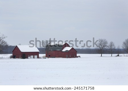 Modern farm in surrounded by the snow-covered fields of Western New York.