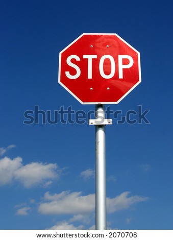 Rec & White U.S. Style Stop Sign On A Pole Against A Deep Blue Sky ...