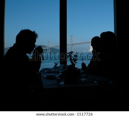 Group of people eating dinner by the San Francisco Bay